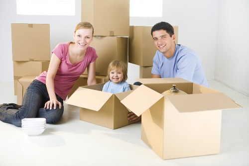Stacked moving boxes and furniture prepared for Twickenham storage