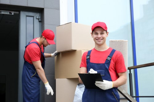 Professional flat removals planning in Twickenham with moving boxes and apartment access