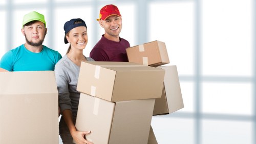 Professional movers handling furniture during a Twickenham house move