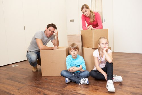 Homeowner unpacking boxes after house removals in Twickenham
